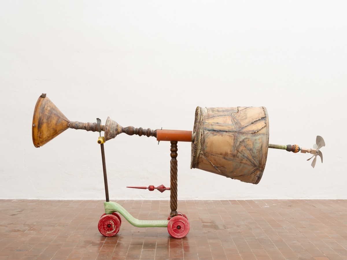 Isabella Costabile - Riddim of the South, 2023 Mixed media on plastic funnel, wooden furniture parts, cloth lampshade, straw basket, wooden bowl, plastic scooter, wooden blocks, plastic pipes, aluminum fan, christmas decoration, bracelets, rope, beads, iron pipe holder 82 x 166 x 46 cm Courtesy the artist and le vite, Milan Photographed by Alessandro Zambianchi