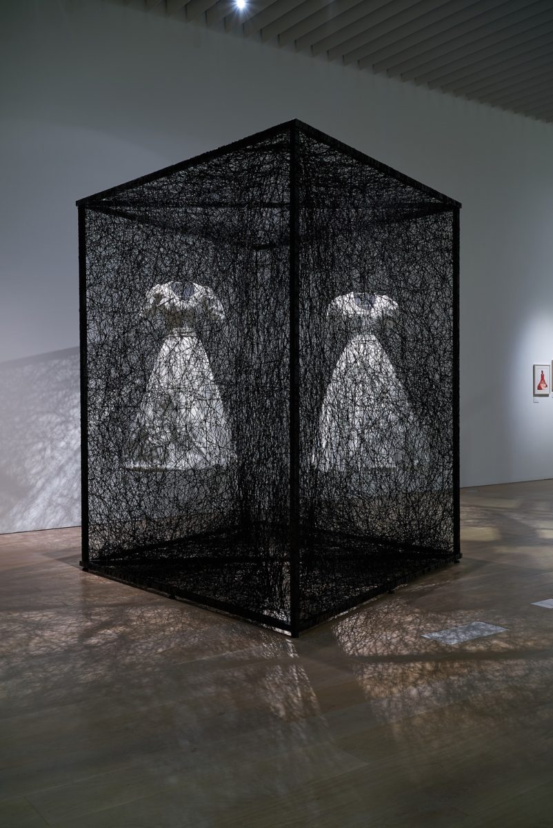 Shiota Chiharu, Reflection of Space and Time 2018 White dress, mirror, metal frame, Alcantara black thread 280 × 300 × 400 cm Commissioned by Alcantara S.p.A Installation view: Shiota Chiharu: The Soul Trembles, Mori Art Museum, Tokyo, 2019 Photo: Sunhi Mang Photo courtesy: Mori Art Museum, Tokyo