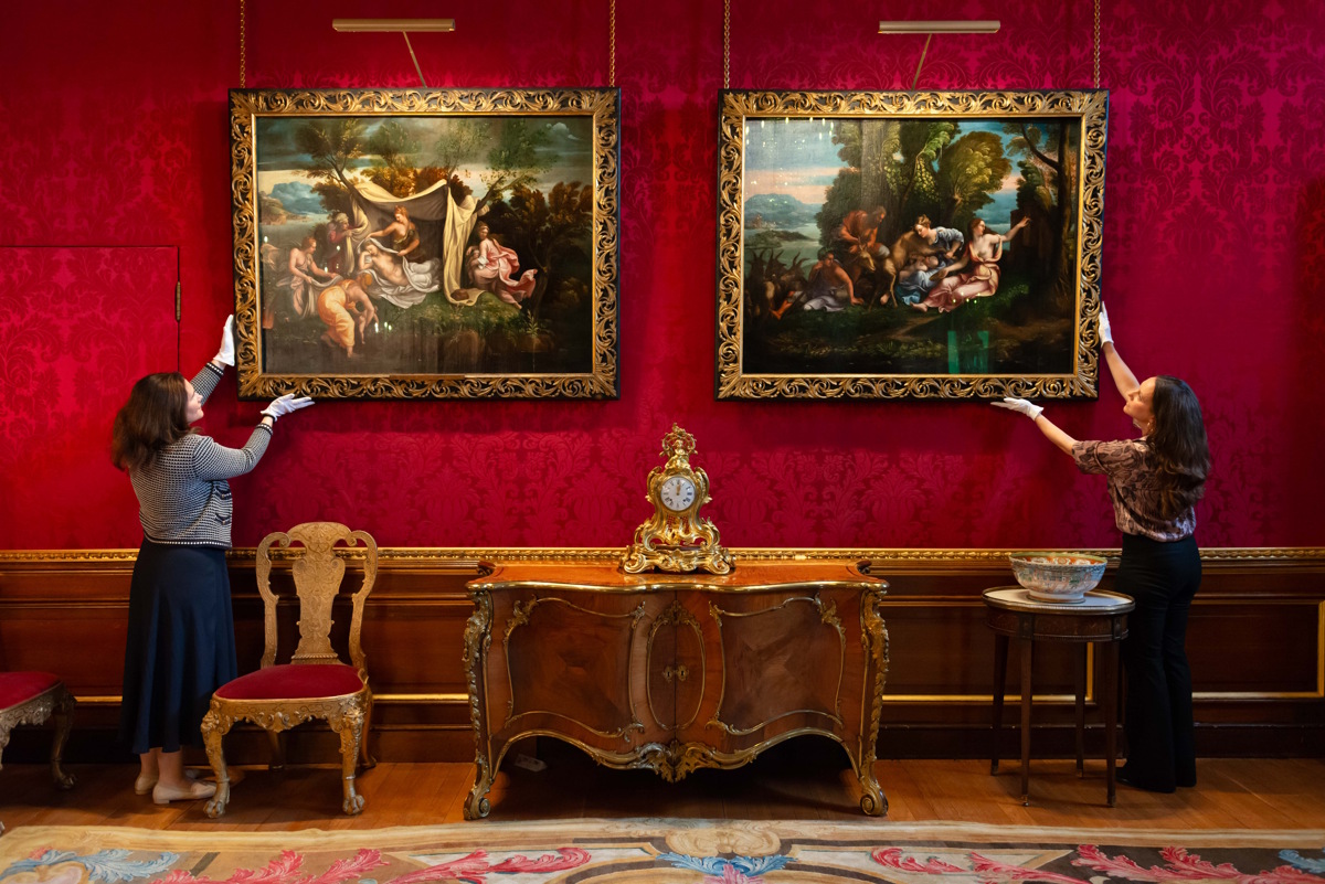 Curators put the finishing touches to the newly installed display in the King’s Bedchamber at Windsor Castle, where Giulio Romano’s The Birth of Diana and Apollo (left) is joined by the newly conserved The Nurture of Jupiter (right)