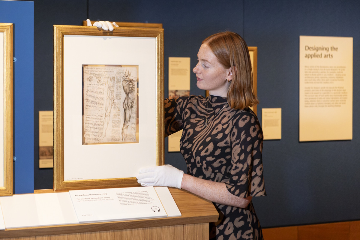 Royal Collection Trust staff making final adjustments to drawings on display
